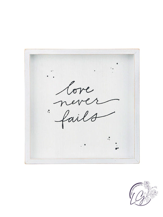 LOVE NEVER FAILS FRAMED BOARD